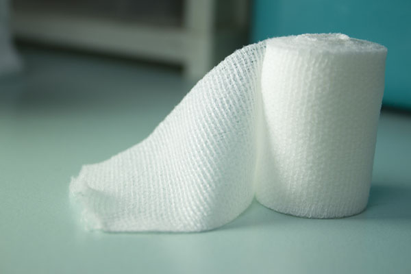 Close up of a clean white rolled up bandage