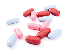 Close up of a pile of coloured medicine caplets
